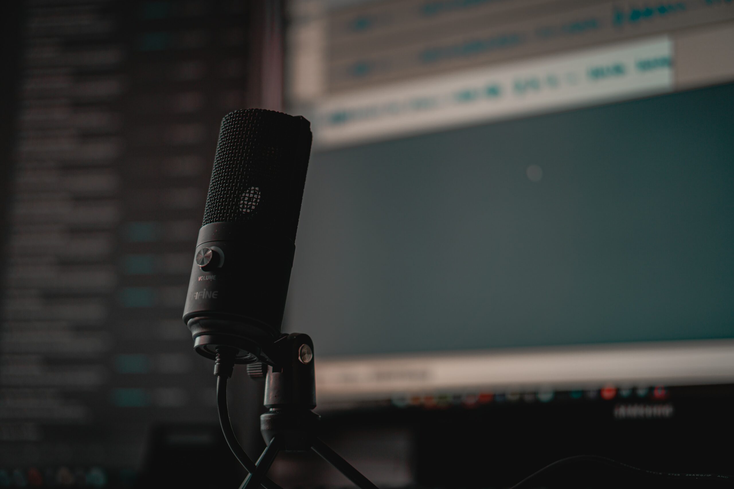 Selective focus photo of a podcast microphone