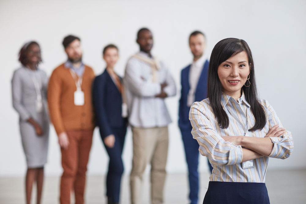 Asian Female Leader with Business Team