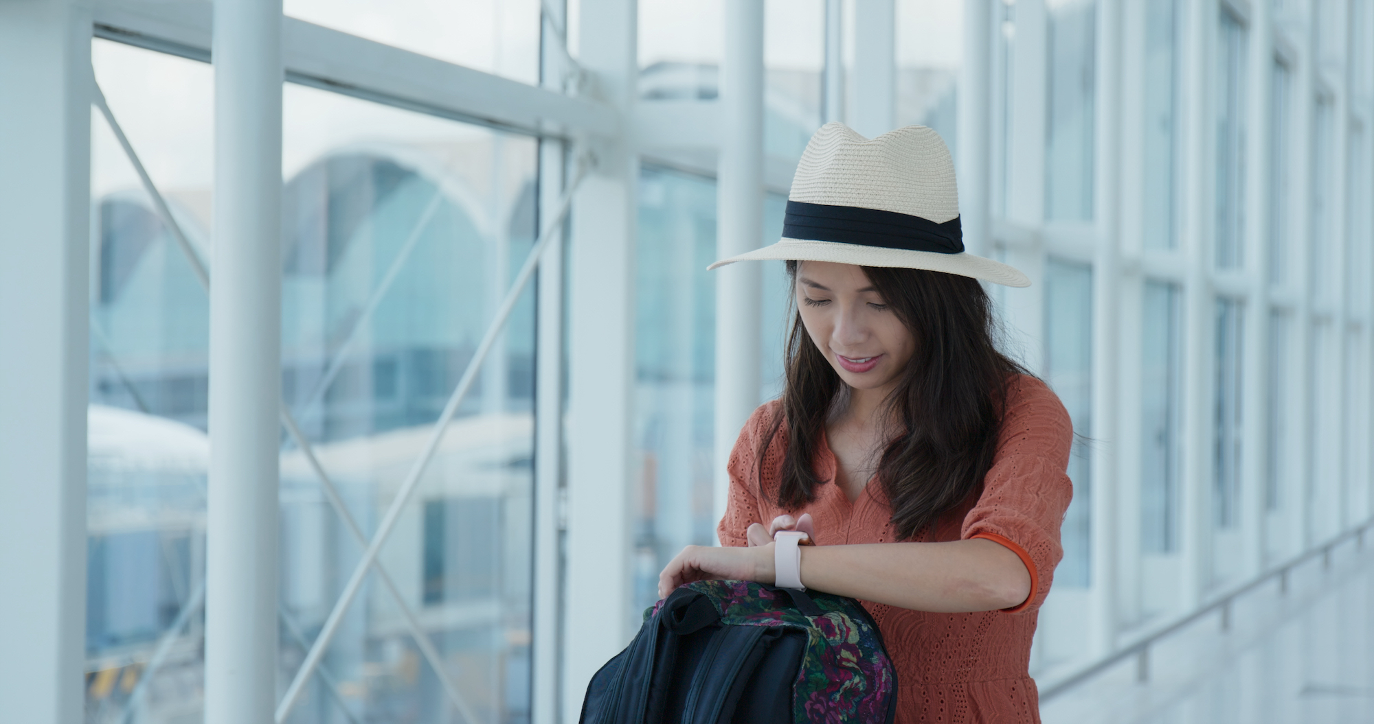 Woman check the time on the smart watch